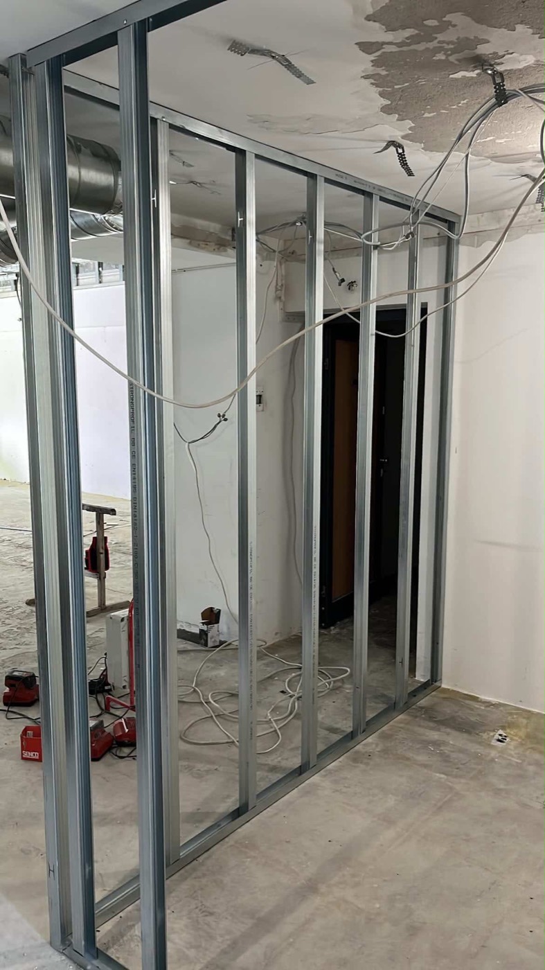 Metal frame of a drywall partition wall in a room being renovated